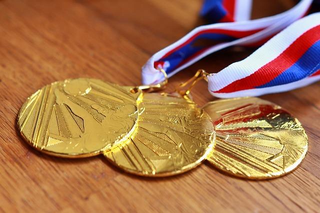 Success trophy and medals representing positive incentives and rewards versus negative consequences in workplace motivation